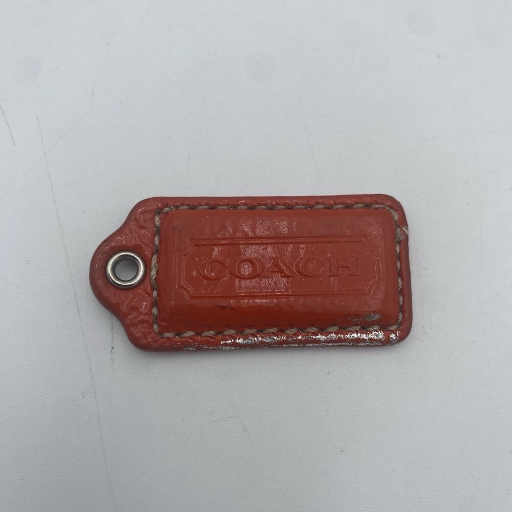 Coach Hang Tag Bag Orange Patent Leather Metallic Silver Back ~ 2 X 1” Bag Charm - Picture 1 of 6